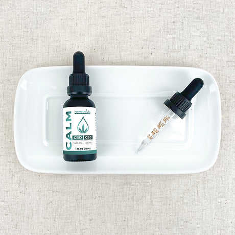 Broad Spectrum Calm CBD Oil on a plate