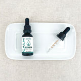 Broad Spectrum Calm CBD Oil on a plate